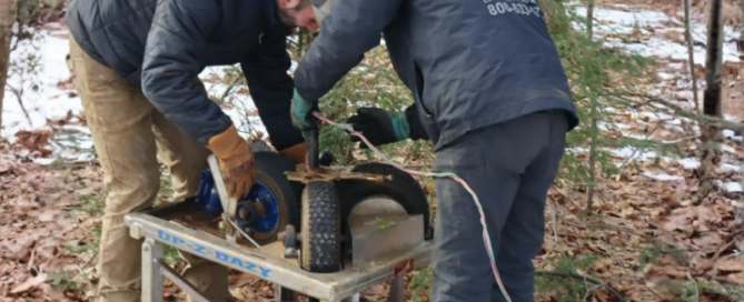 County Pump & Supply technicians diagnosing low well water pressure during a service call